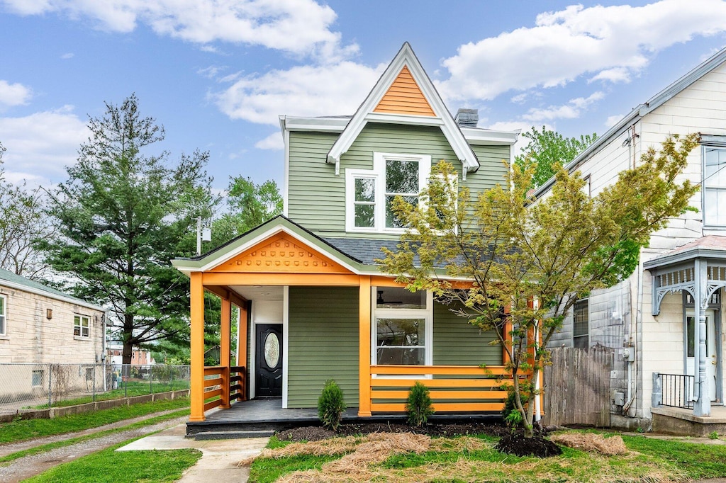 817 Ervin Ter, Dayton, KY 41074 - view of front of house with a porch, fence, and a chimney