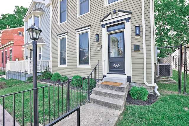 doorway to property featuring central air condition unit