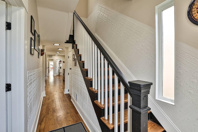 stairs with wood finished floors