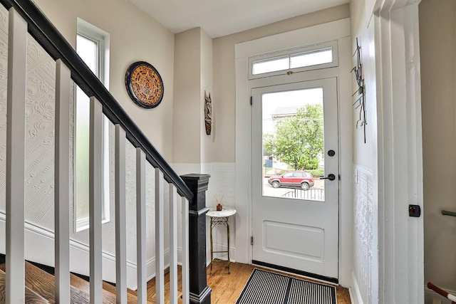 entryway featuring light wood-style floors and stairway