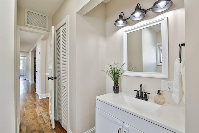 bathroom featuring vanity and wood finished floors