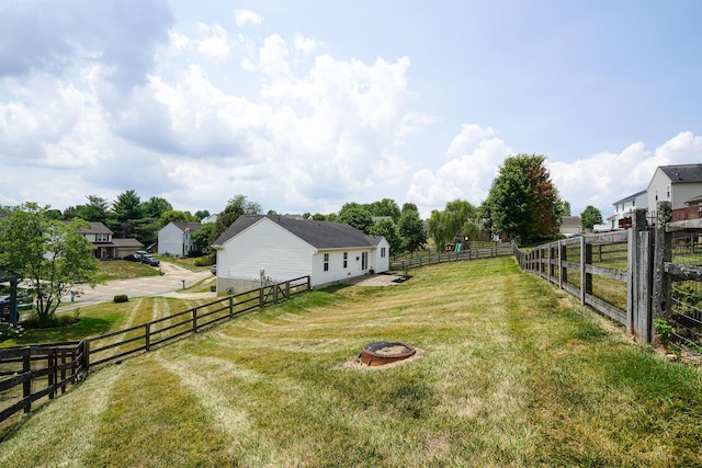 view of yard with an outdoor fire pit