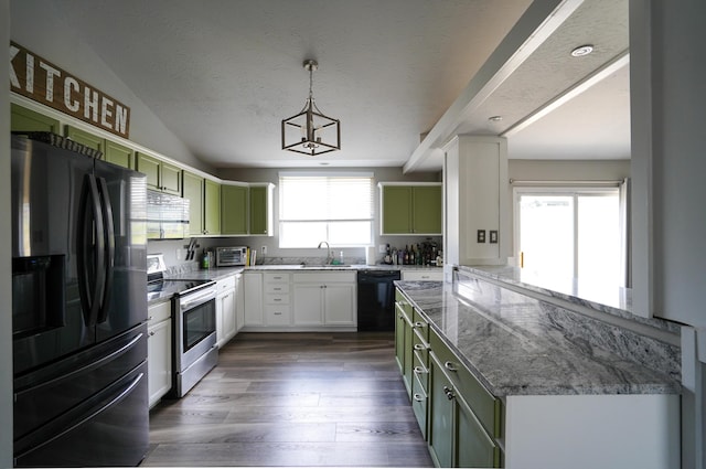 kitchen featuring black appliances, green cabinets, a sink, dark wood finished floors, and light stone counters