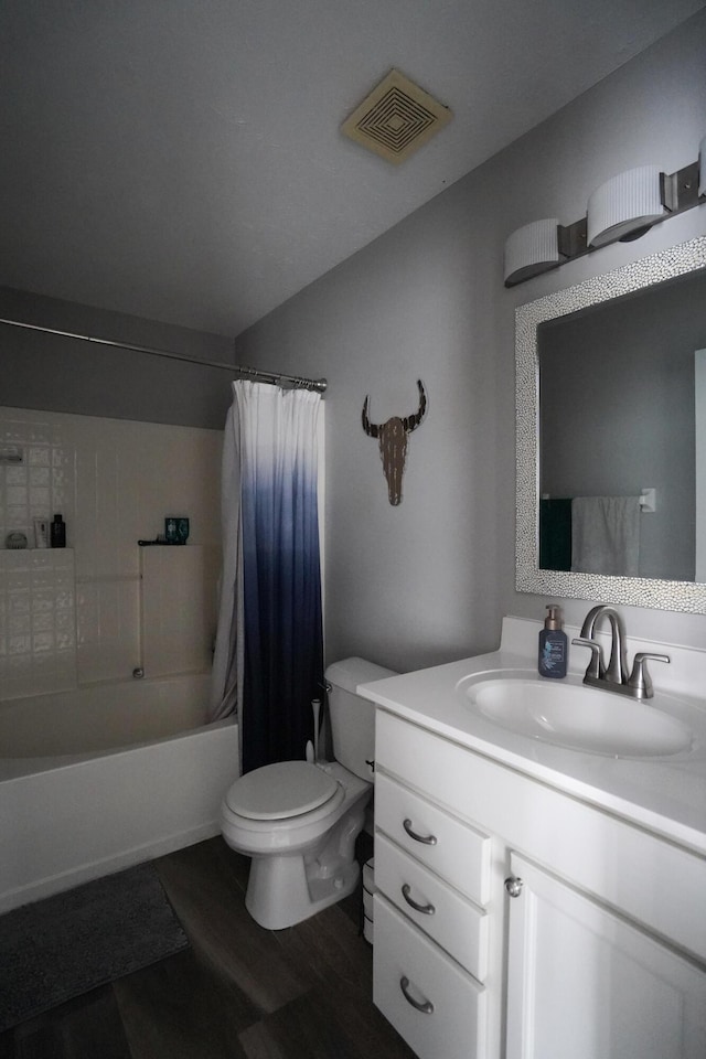 full bath featuring toilet, vanity, shower / tub combo with curtain, and wood finished floors