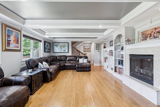 214 Clifton Ave, Newport, KY 41071 - living area with ornamental molding, a fireplace, light wood-style floors, built in features, and baseboards