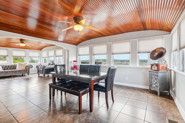 214 Clifton Ave, Newport, KY 41071 - tiled dining area featuring vaulted ceiling, a ceiling fan, wooden ceiling, baseboards, and arched walkways