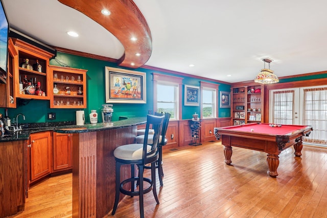214 Clifton Ave, Newport, KY 41071 - indoor wet bar featuring crown molding, billiards, light wood-style flooring, a wainscoted wall, and french doors