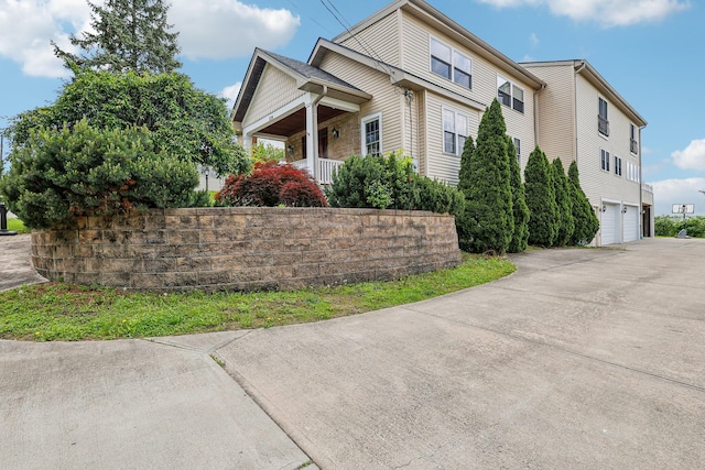 214 Clifton Ave, Newport, KY 41071 - view of home's exterior with a garage, driveway, and a porch