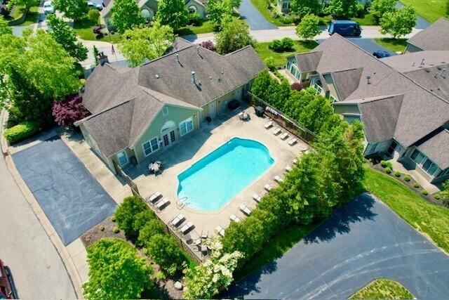 aerial view of residential area featuring a pool area