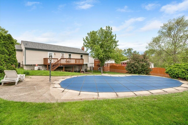 view of pool with stairs, a wooden deck, and a patio area