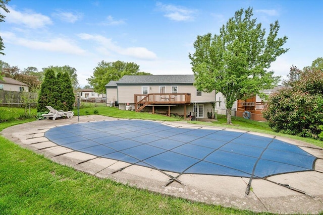 view of swimming pool featuring a wooden deck, a patio area, and stairway