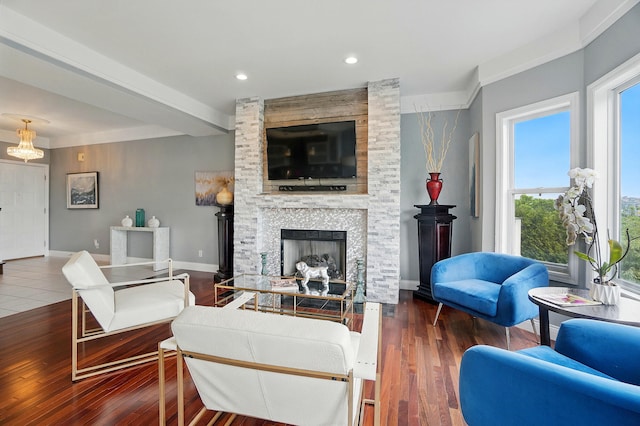 516 Western Ave, Covington, KY 41011 - living room featuring a stone fireplace, wood finished floors, baseboards, and recessed lighting