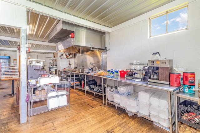 7595 Willow Lenoxburg Rd, Foster, KY 41043 - kitchen featuring wood-type flooring and concrete block wall