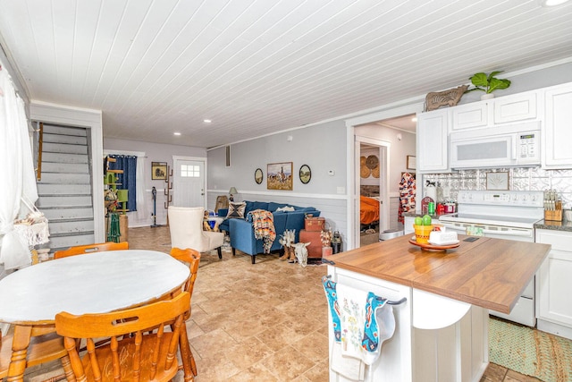 7595 Willow Lenoxburg Rd, Foster, KY 41043 - dining room with stairs, wood ceiling, recessed lighting, and wainscoting
