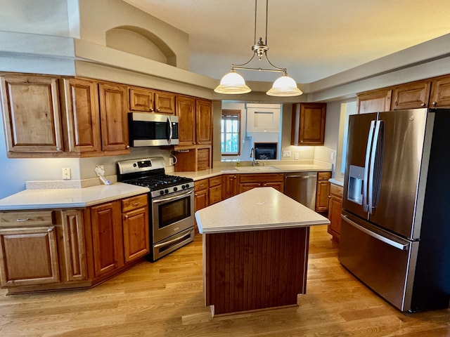 410 Links View Dr, Butler, KY 41006 - kitchen with stainless steel appliances, brown cabinetry, and light countertops