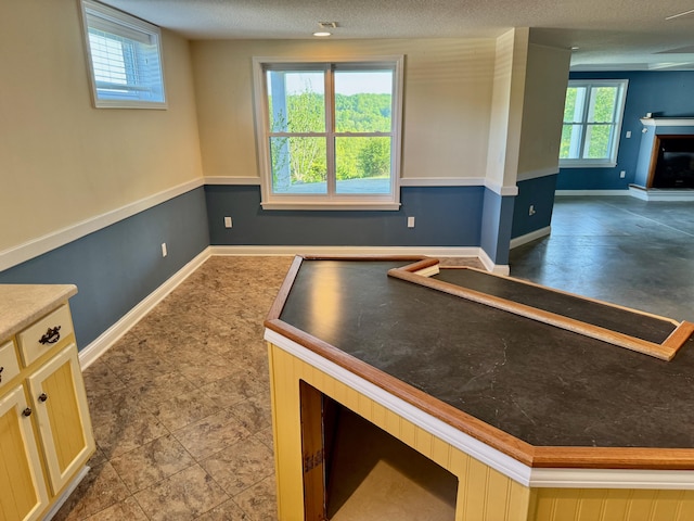 410 Links View Dr, Butler, KY 41006 - unfurnished dining area featuring baseboards and a fireplace