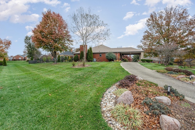 1051 Arden Dr, Villa Hills, KY 41017 - view of front of property featuring a front yard, a carport, concrete driveway, and a chimney