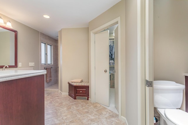 1051 Arden Dr, Villa Hills, KY 41017 - bathroom with toilet, vanity, tile patterned floors, a shower, and a spacious closet