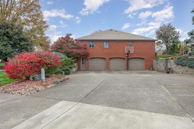 1051 Arden Dr, Villa Hills, KY 41017 - view of side of home with a garage, concrete driveway, and brick siding