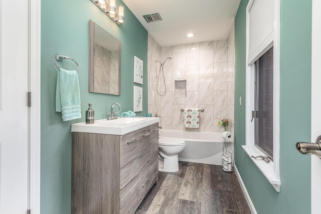 1051 Arden Dr, Villa Hills, KY 41017 - bathroom featuring toilet,  shower combination, wood finished floors, and vanity