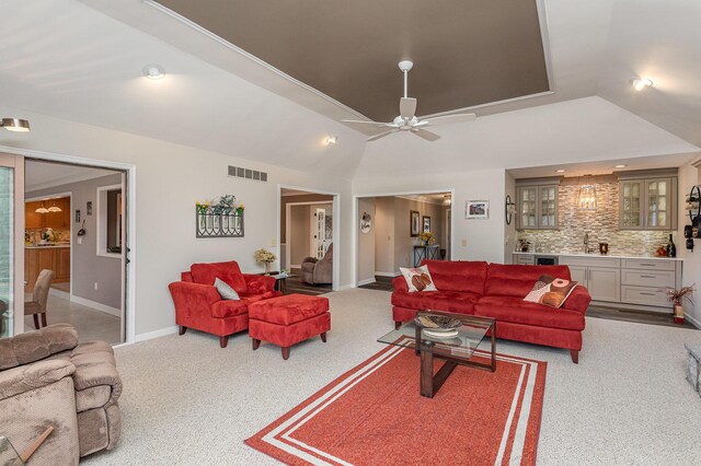 1051 Arden Dr, Villa Hills, KY 41017 - carpeted living room featuring recessed lighting, lofted ceiling, baseboards, a sink, and ceiling fan