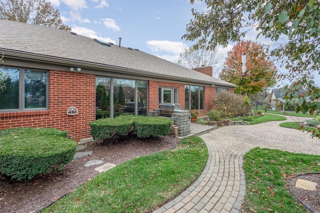 1051 Arden Dr, Villa Hills, KY 41017 - exterior space with brick siding, a chimney, and roof with shingles