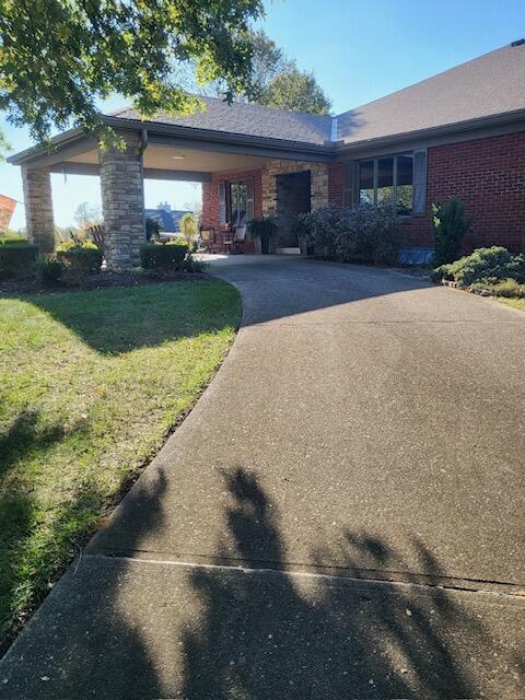 1051 Arden Dr, Villa Hills, KY 41017 - view of front of home with a front lawn, brick siding, and driveway