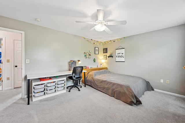 carpeted bedroom featuring ceiling fan and baseboards