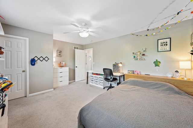bedroom featuring a desk, baseboards, carpet, and a ceiling fan