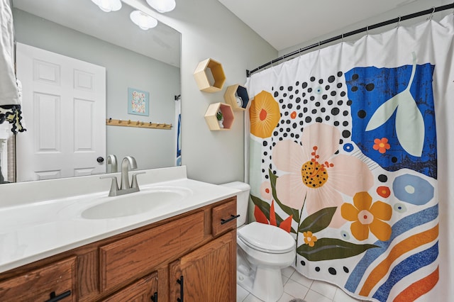 bathroom with tile patterned floors, toilet, vanity, and a shower with shower curtain