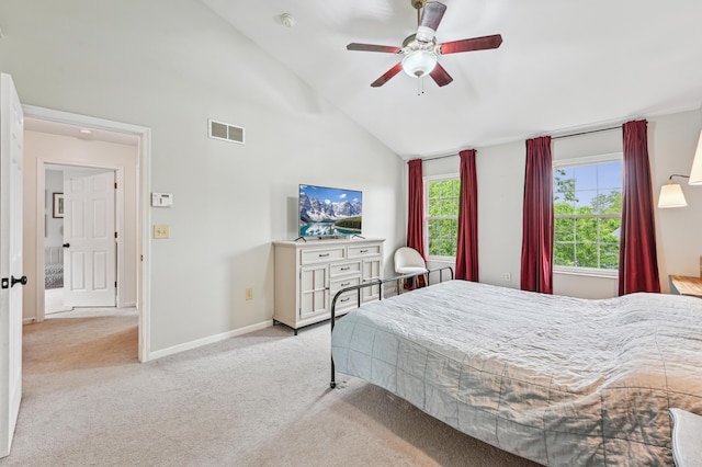 carpeted bedroom with high vaulted ceiling, baseboards, and ceiling fan