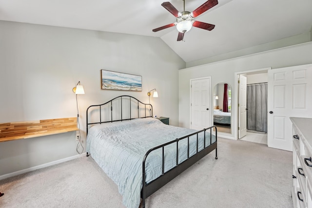 bedroom featuring light colored carpet, lofted ceiling, baseboards, ceiling fan, and arched walkways