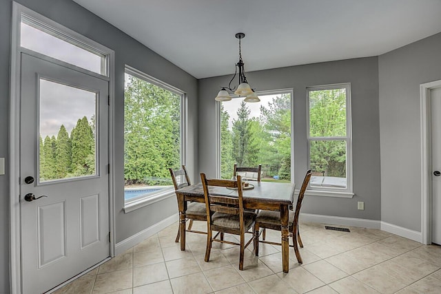 2282 Treetop Ln, Hebron, KY 41048 - dining space featuring healthy amount of natural light, baseboards, and light tile patterned floors
