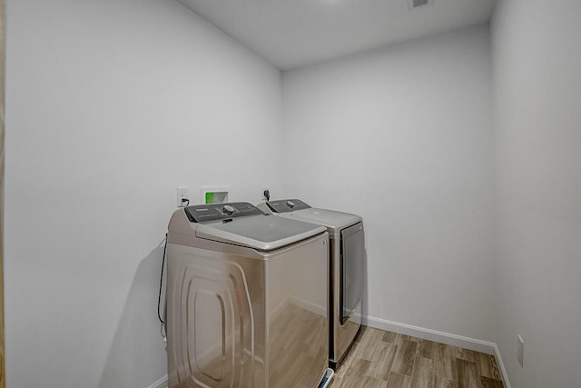 1782 Autumn Maple Dr, Independence, KY 41051 - washroom with separate washer and dryer, light wood-style flooring, and baseboards