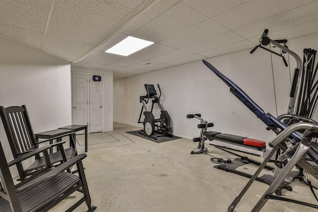 exercise room with a paneled ceiling