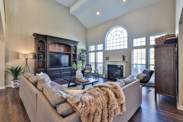 living area with high vaulted ceiling, baseboards, a fireplace with flush hearth, dark wood-style floors, and recessed lighting