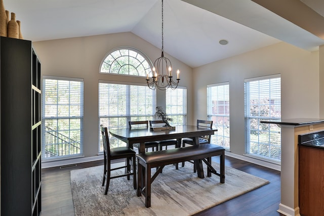 dining area with vaulted ceiling, a chandelier, and dark wood-type flooring
