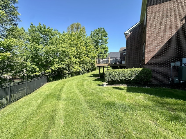 view of yard featuring a wooden deck