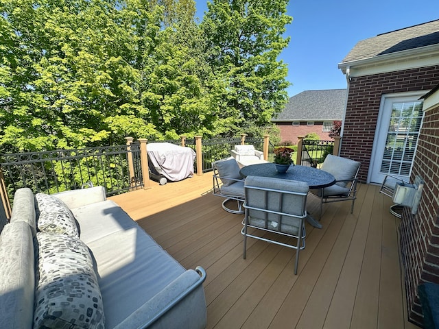 deck with outdoor dining area
