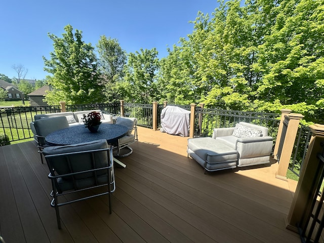 wooden deck with grilling area