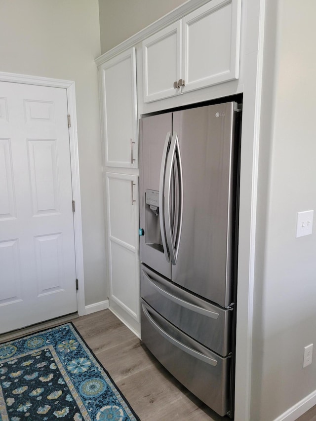 6403 Arabian Dr, Independence, KY 41051 - kitchen featuring stainless steel fridge, white cabinetry, light wood finished floors, and baseboards