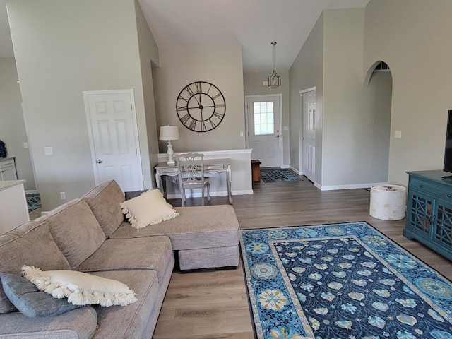 6403 Arabian Dr, Independence, KY 41051 - living area with wood finished floors, baseboards, and high vaulted ceiling