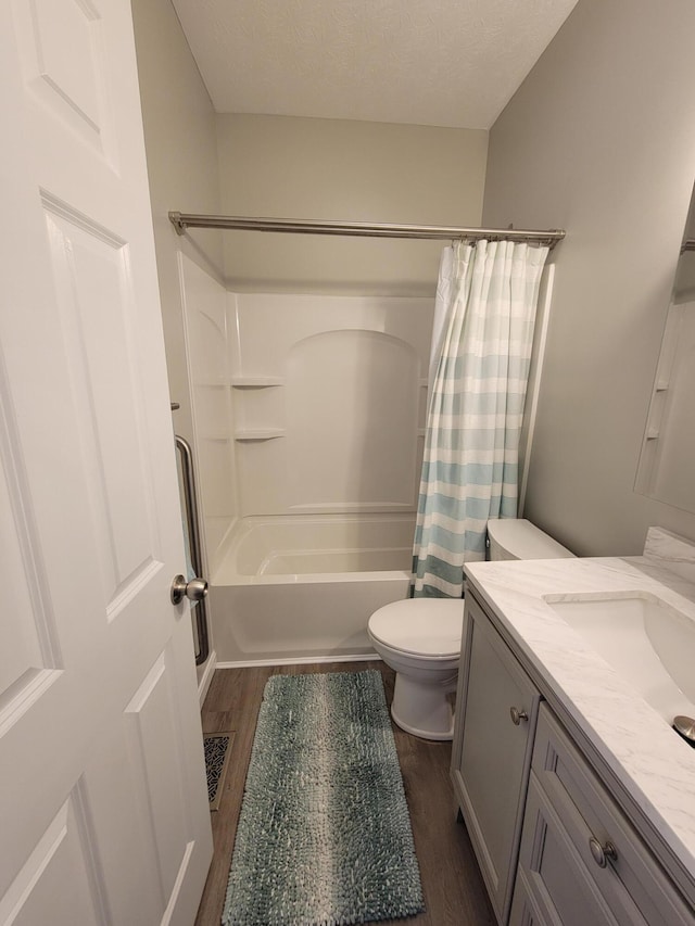 6403 Arabian Dr, Independence, KY 41051 - full bath featuring wood finished floors, toilet, shower / bathtub combination with curtain, vanity, and a textured ceiling