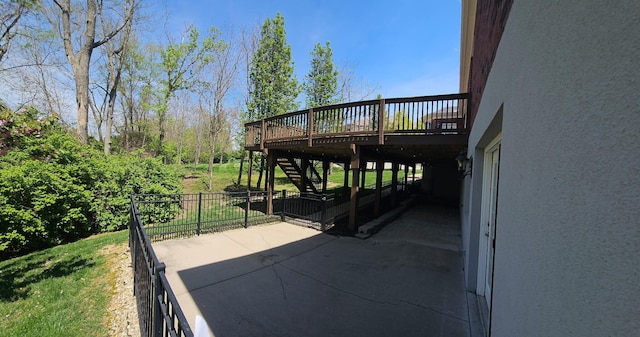 view of patio / terrace with stairway and a wooden deck
