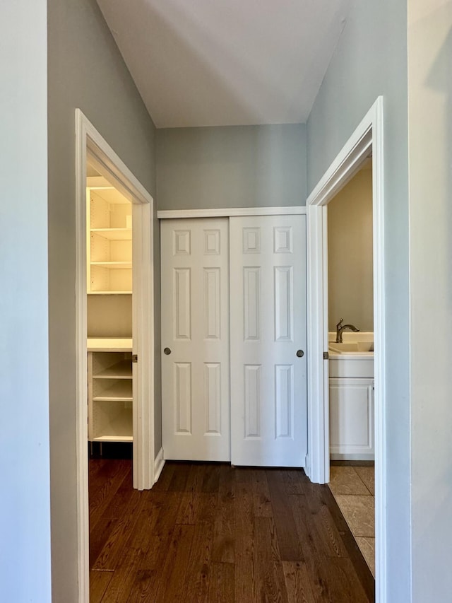 hall featuring dark wood finished floors