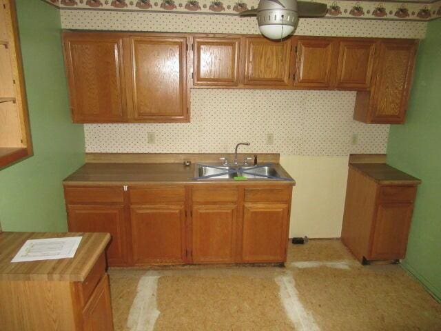 1101 Plateau St, Elsmere, KY 41018 - kitchen with a sink, brown cabinets, and decorative backsplash