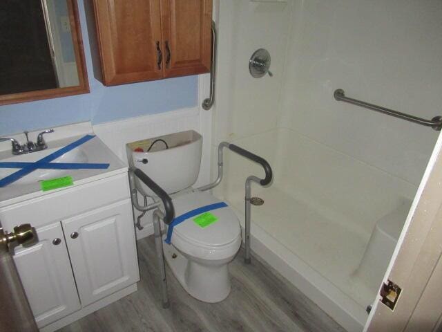 1101 Plateau St, Elsmere, KY 41018 - bathroom with a stall shower, wood finished floors, vanity, and toilet