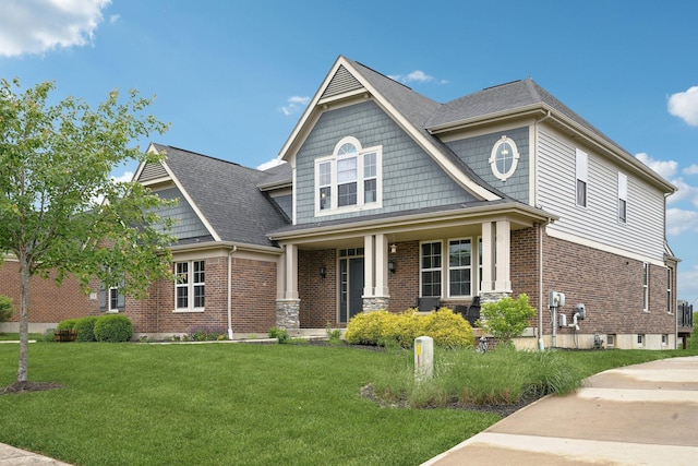 574 Ravensridge Ct, Alexandria, KY 41001 - craftsman-style home with a porch, a front lawn, brick siding, and a shingled roof