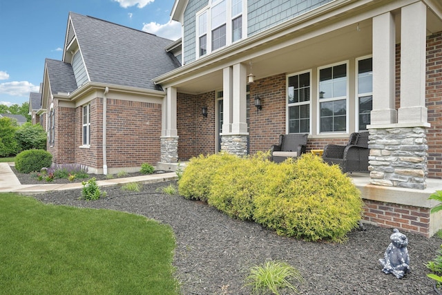 574 Ravensridge Ct, Alexandria, KY 41001 - property entrance featuring a porch, brick siding, and roof with shingles