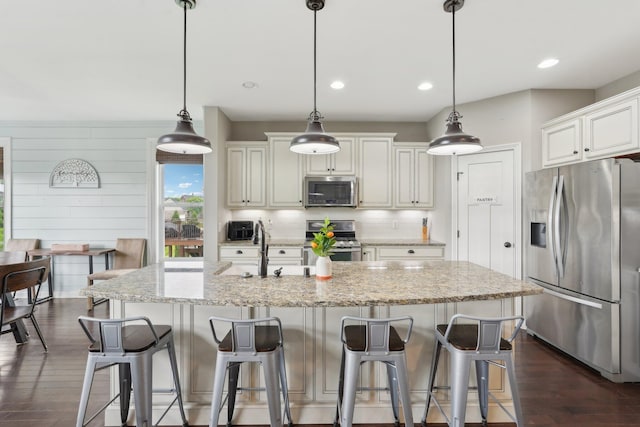 574 Ravensridge Ct, Alexandria, KY 41001 - kitchen featuring appliances with stainless steel finishes, backsplash, a sink, dark wood-style floors, and light stone counters